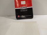 a box of air filters sitting on top of a white table