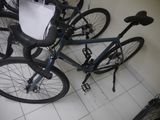 several bikes are lined up in a row on a tiled floor