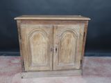 an old wooden cabinet with two doors and two drawers