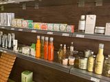 a woman standing in front of a counter in a store