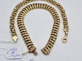 a gold chain bracelet with a gold clasp