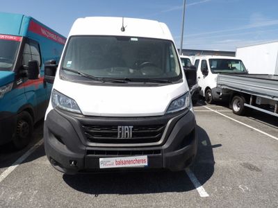 a white van that is parked in a parking lot