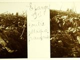 an old black and white photo of a man laying in a field of flowers