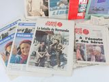 several newspapers on a table with pictures of people on them