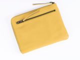 a yellow leather wallet with a zipper and a metal handle