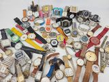 many different types of watches on a white surface