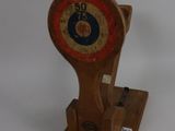 a wooden clock on a stand on a white surface