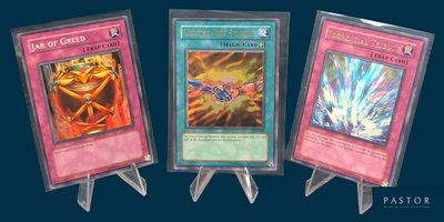 three cards are displayed in plastic holders on a blue background