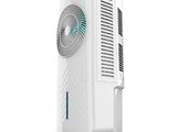 a white air conditioner sitting on top of a white stand