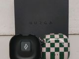 a black box with a green and white checkered case next to it