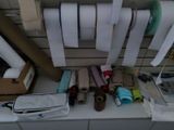 many rolls of white paper on the counter