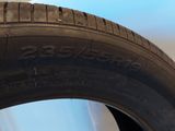 tire tread of a car on the floor next to a wall