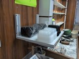 a counter with a bunch of plastic containers on it
