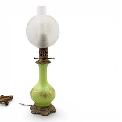 a green lamp that is sitting on a table