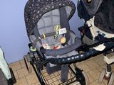 two strollers that are sitting next to each other on the floor