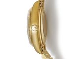 a close up of a watch on a white surface with a white background
