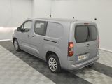a silver van that is parked in a garage