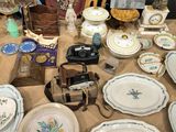 many different types of plates and bowls on the table