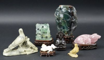five different kinds of figurines sitting on a table