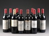 six bottles of wine are lined up in a row on a table