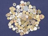 a pile of coins on a blue surface
