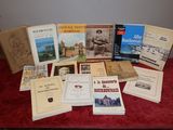several books on a table with a red cloth on it