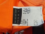 an orange t - shirt with a black and white label on it
