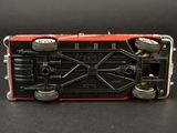 a toy truck that is sitting on a black surface