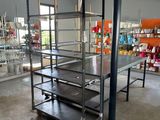 a room with shelves and a table in it