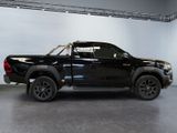 a picture of a black pickup truck parked in a garage