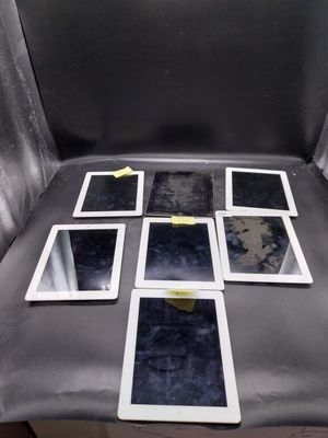 a chair with a bunch of tablet computers on top of it