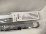 a box with a toothbrush and a tube of toothpaste in it
