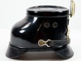 a black hat that has a metal buckle on it