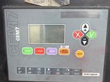 a machine that is sitting on the ground with buttons on it