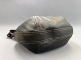 black leather pouch with white stitching on the side