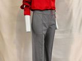 an image of a mannequin wearing a red shirt and grey pants