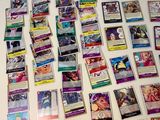a table with a lot of pokemon cards on it