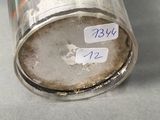 a silver can with a label on it on a table