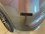 a close up of a car with a sticker on it ' s bumper