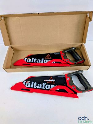 two red and black hand saws in a cardboard box