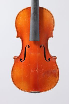 a close up of a violin with a bow on a white background