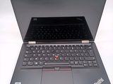 a laptop with a keyboard on it sitting on a table
