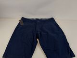 a pair of blue shorts sitting on top of a white table