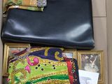 a box with a purse and other items inside of it