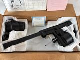 a box with a gun in it on a table