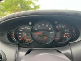 a close up of a car dashboard with various gauges