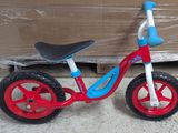 a small red and blue bike with a black seat