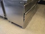 a kitchen with stainless steel appliances in it