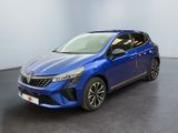 une voiture bleue garée dans une pièce au sol noir