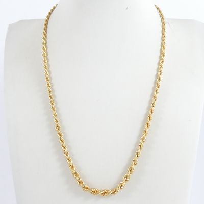 a gold necklace on a mannequin mannequin mannequin mannequin mannequin mannequin mannequin mannequin mannequin